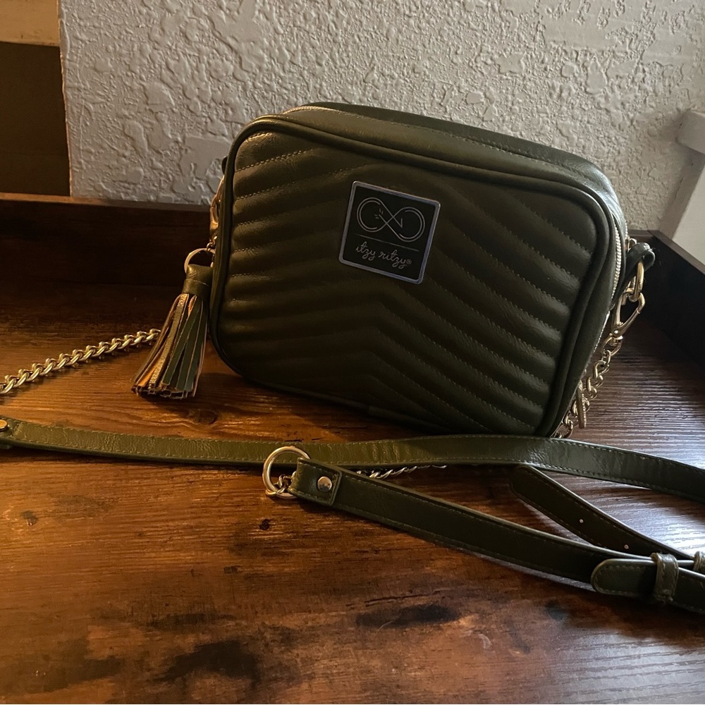 Olive green Itsy Ritzy double sided crossbody diaper bag.